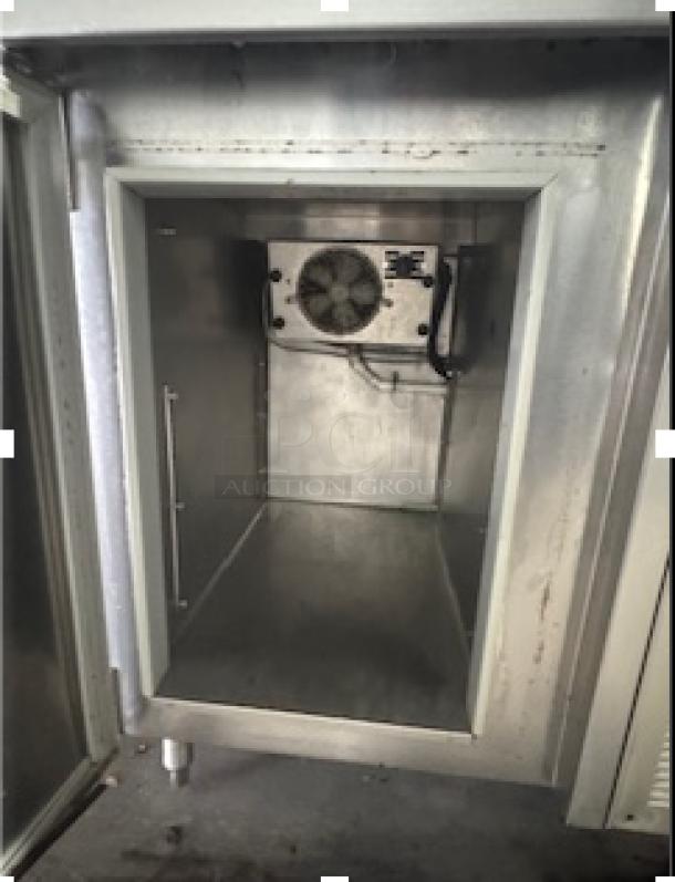 Three compartment sink with attached two-door cooler, ideal for restaurants. Features a stainless steel interior and visible cooling system in good condition.