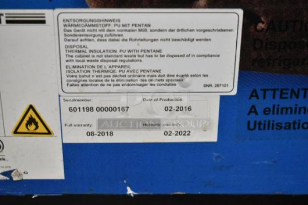 AHT RIO S 100 commercial chest freezer, tested, missing right glass pane, on casters. Serial: 60119800000167.