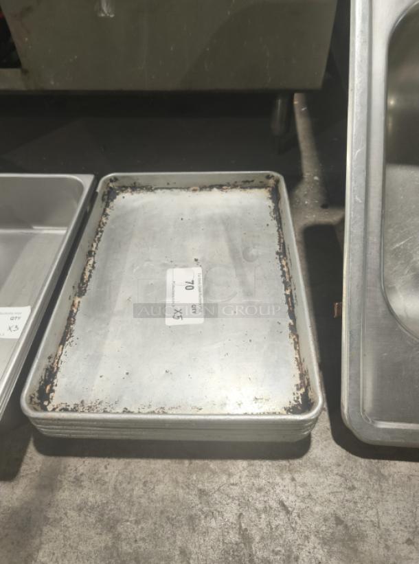 Commercial heavy-duty aluminum half-sheet pan, worn condition, visible label with lot number 70.
