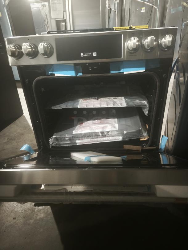 GE Café 30" smart range, model CES700P2MS1, new condition, stainless steel, slide-in, front-control radiant and convection.