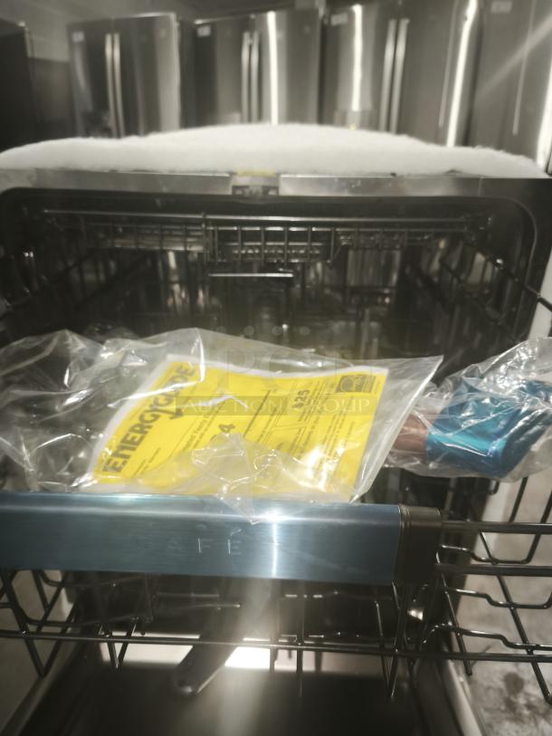 BRAND NEW SCRATCH AND DENT GE® dishwasher GDT670SMV1ES, stainless steel interior, top control, with tag and packaging inside.