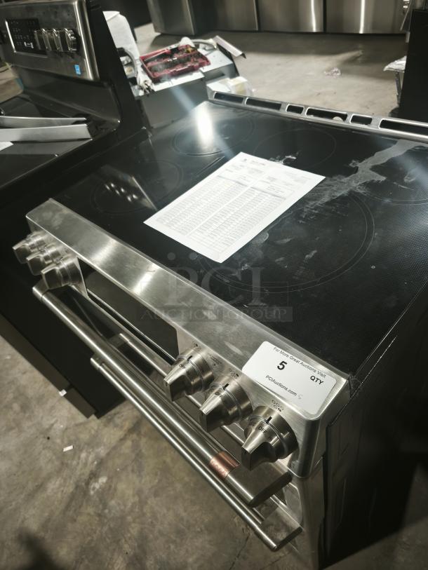 BRAND NEW Café 30″ Smart Slide-In Induction and Convection Double-Oven Range, Model CHS950P2MS1, with minor scratches and dents.
