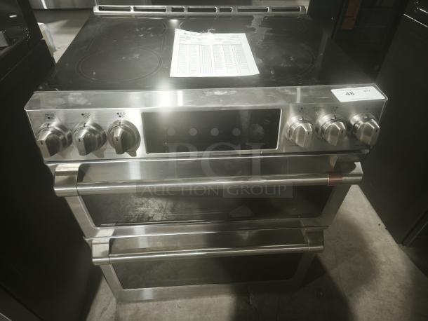 BRAND NEW Café 30″ Smart Slide-In Range, GE Model CHS950P2MS1, induction and convection double oven, slight cosmetic imperfections.