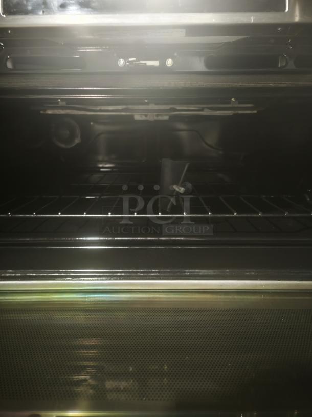 BRAND NEW SCRATCH AND DENT GE Café 30″ Smart Slide-In Induction Double-Oven Range, Model CHS950P2MS1. Clean interior shown.