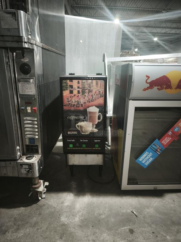 BUNN FMD-3 Fresh Mix Hot Drink Dispenser, 3-hopper model. Features cappuccino, hot chocolate, French vanilla options. Well-maintained.