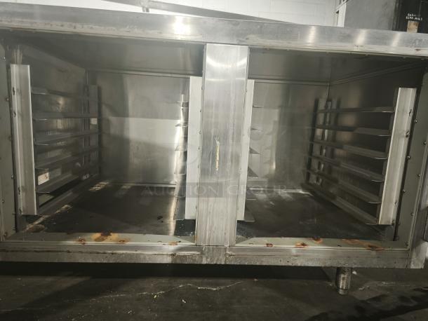 Victory URS-2S2 commercial refrigerator prep table; stainless steel, sandwich/salad model; visible wear and rust; interior shelves.