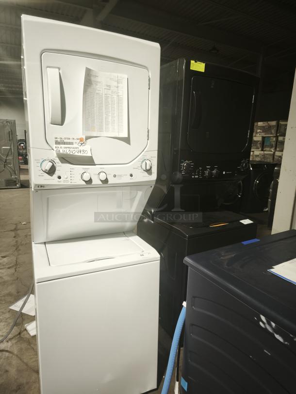NEW GE Unitized Spacemaker washer and dryer, model GUD24ESSMWW. Features include a 2.3 cu ft washer with stainless steel basket and 4.4 cu ft electric dryer. New condition with visible product tags.