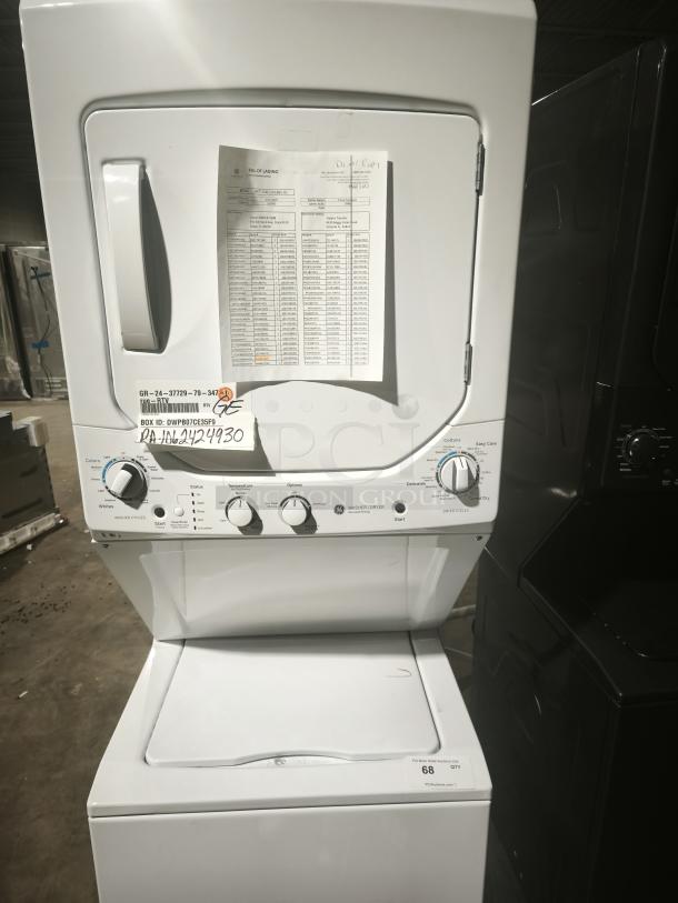 NEW GE Spacemaker® washer and dryer unit, model GUD24ESSMWW, 2.3 cu ft washer, 4.4 cu ft dryer, controls visible, pristine condition.