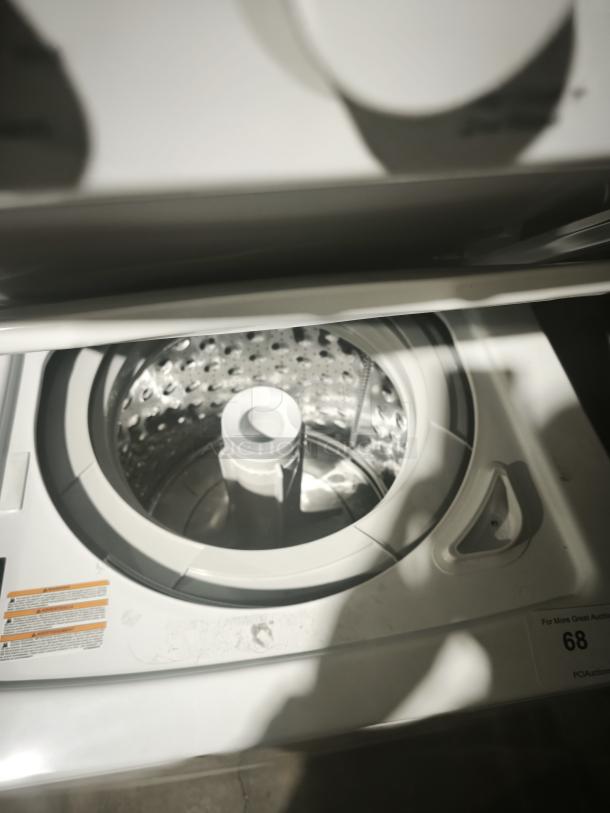 NEW GE Spacemaker washer and electric dryer, model GUD24ESSMWW. Features stainless steel basket. Mint condition.