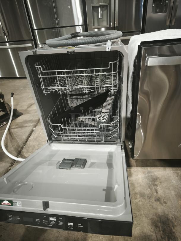 GE Top Control Dishwasher GDT550PYRFS, new condition, plastic interior, sanitize cycle, Dry Boost feature visible.