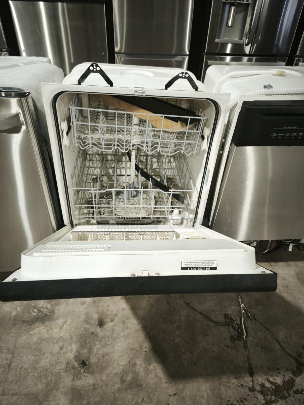 Whirlpool undercounter dishwasher by GE, model DU925QWDB0, open to show interior racks, in good condition.