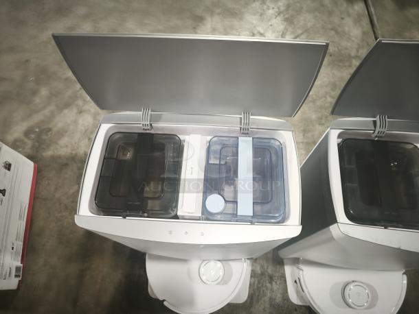 Ecovacs DEEBOT T10 OMNI robot vacuum and mop with open auto-cleaning stations, highlighting compartments and sleek design.