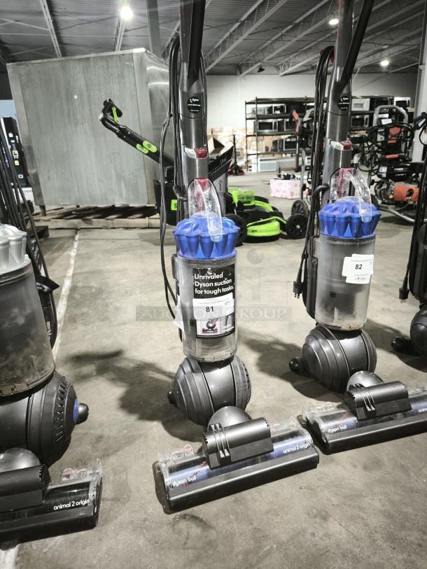 Dyson Ball Multi Floor 2 vacuum, Model UP19, upright with ball design, in good condition with label noting unrivaled suction.