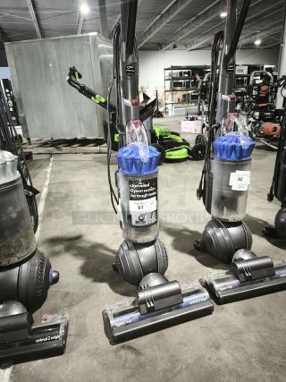 Dyson Ball Multi Floor 2 vacuum, Model UP19, upright with ball design, in good condition with label noting unrivaled suction.