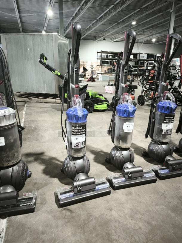 Dyson Ball Multi Floor 2 UP19 vacuums displayed in a warehouse. Featuring ball technology, "Unrivaled Dyson suction" label visible.