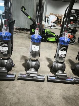 Dyson Ball Multi Floor 2 vacuum, model UP19, upright with blue cyclone, labeled "Unrivaled Dyson suction," in good condition.