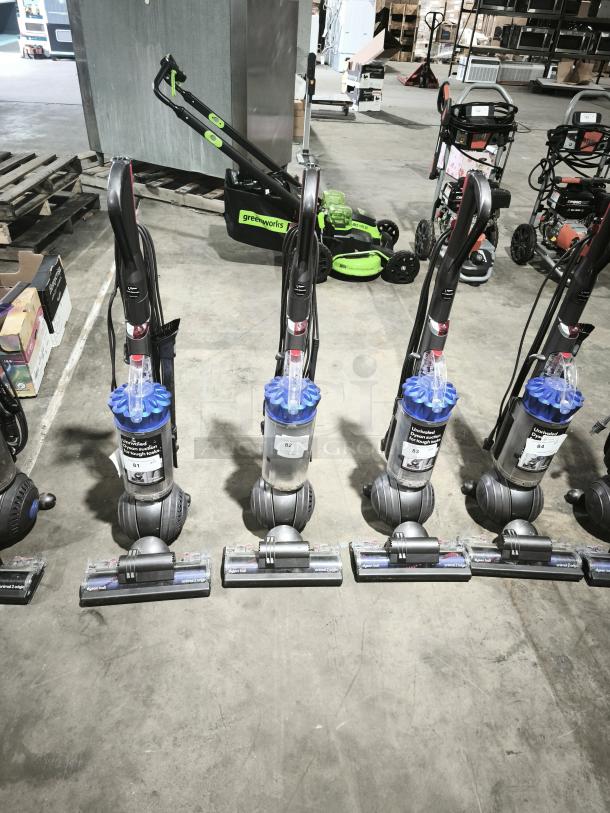 Dyson Ball Multi Floor 2 UP19 vacuums on display, excellent condition, clean bins, visible model and serial tags.