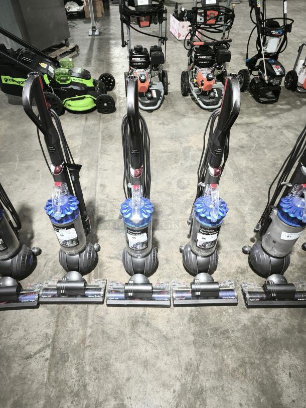 Dyson Ball Multi Floor 2 (Model UP19) vacuum, multiple units shown, gray and blue, upright design, good condition.