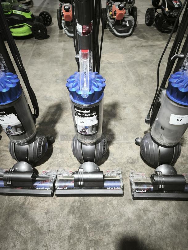 Dyson Ball Multi Floor 2 vacuum (Model UP19) with blue cyclone, clear dust bin, "Unrivaled Dyson Suction" label, good condition.