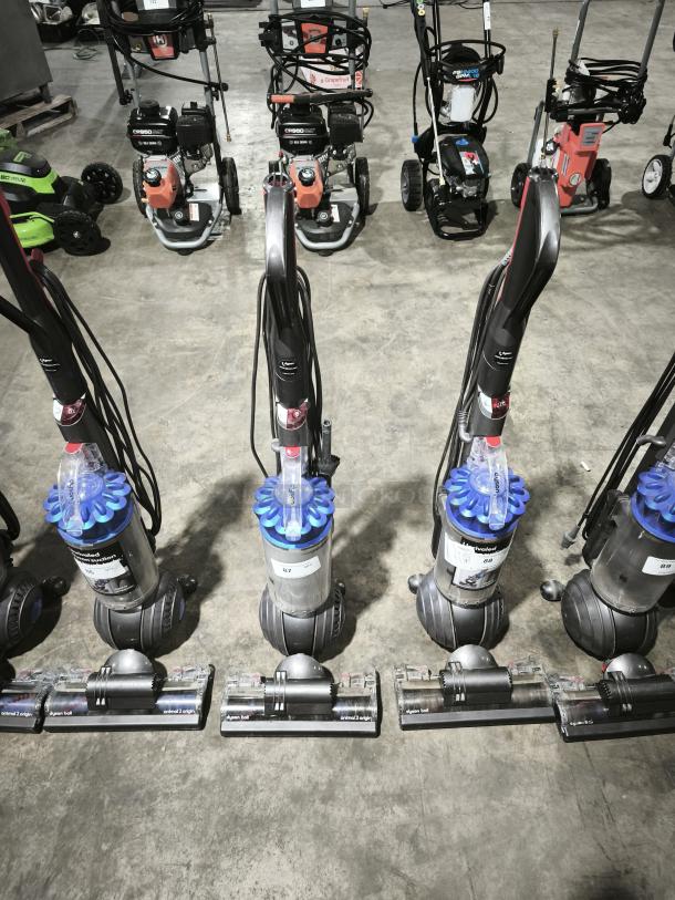 Dyson Ball Multi Floor 2 vacuum, model UP19, new condition, blue cyclone component, auction labels visible.