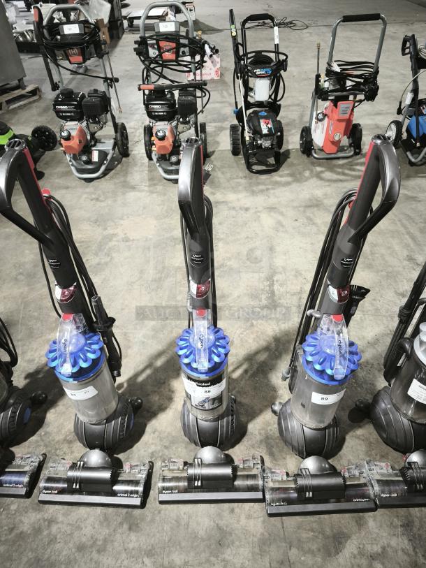 Dyson Ball Multi Floor 2 vacuum, Model UP19, in good condition. Features distinctive ball design for maneuverability. Tags display model and condition information.