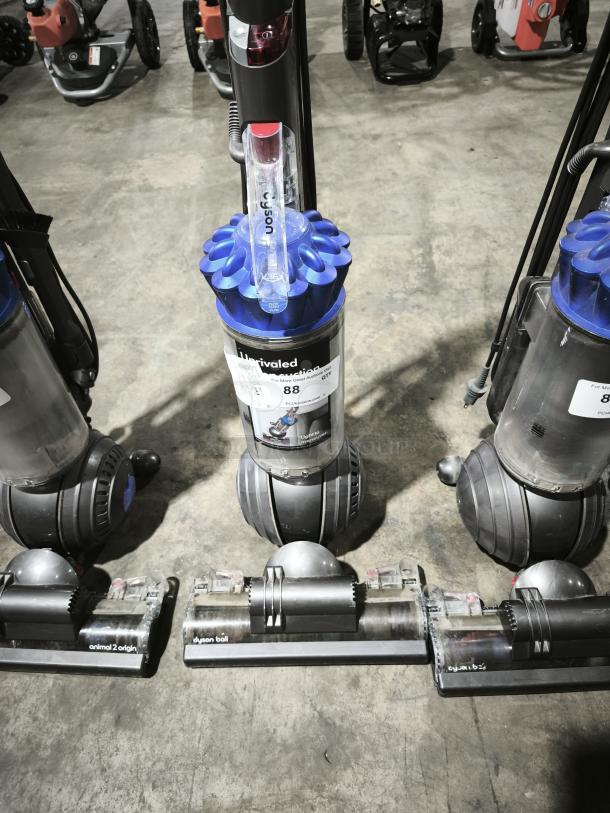 Dyson Ball Multi Floor 2 vacuum (Model UP19), blue and gray finish, upright design, auction tag visible, good condition.