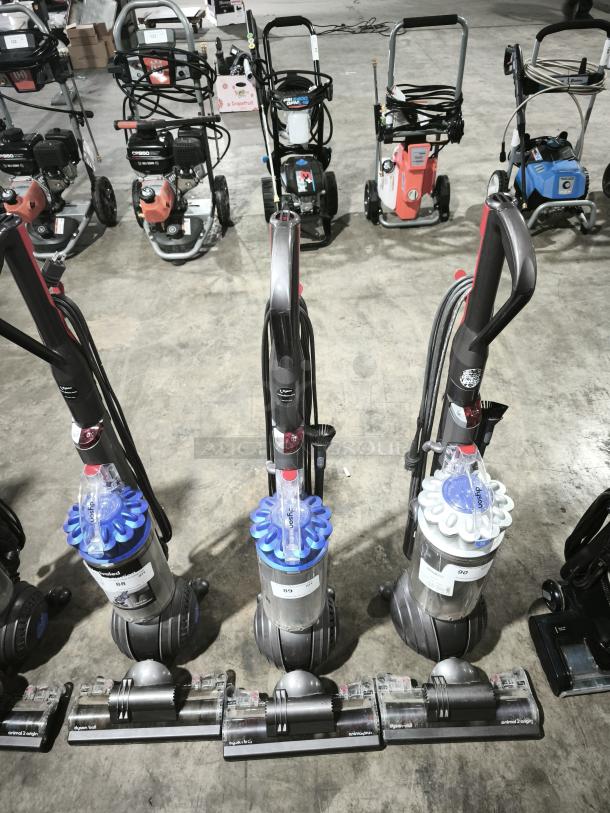 Dyson Ball Multi Floor 2 vacuums (Model UP19), showing three units with tags numbered 89 and 90. Features Dyson Ball technology.
