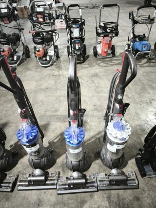 Dyson Ball Multi Floor 2 vacuums (Model UP19), showing three units with tags numbered 89 and 90. Features Dyson Ball technology.