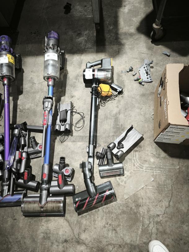 LG CordZero™ A9 Cordless Stick Vacuum A916BM, displayed on floor, with detachable parts, in used condition.