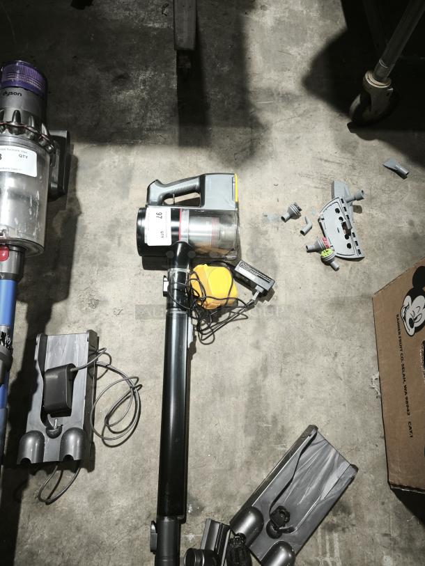 LG CordZero™ A9 A916BM cordless stick vacuum, disassembled, visible components and charger included, good condition.