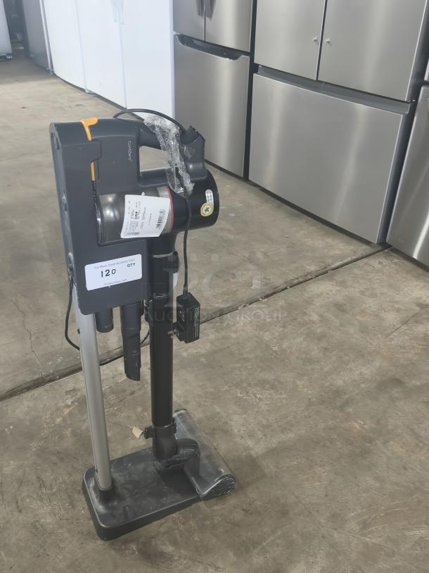 Dyson V11 Torque Drive PLUS Cordless Vacuum, with charger, upright on stand, in excellent condition.