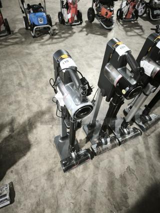 LG CordZero A9 Cordless Stick Vacuum, model A916BM, displayed upright on stand. Visible LG branding, auction tag 110.