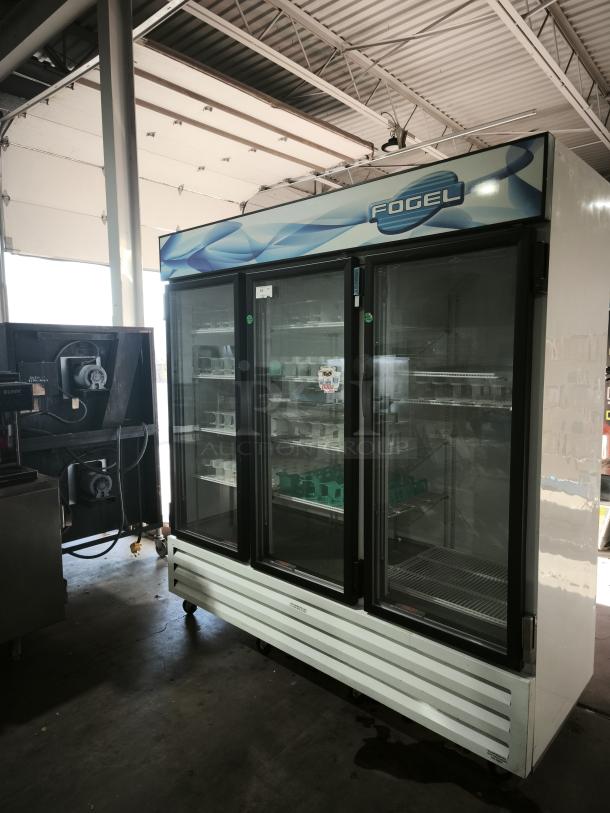 Fogel CR-65-US 78" reach-in refrigerator with three hinged glass doors, approx 65 cu ft capacity, in used condition.