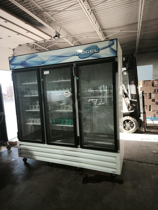 Fogel CR-65-US 78" reach-in refrigerator with three hinged glass doors, approx. 65 cu ft. capacity, good condition.