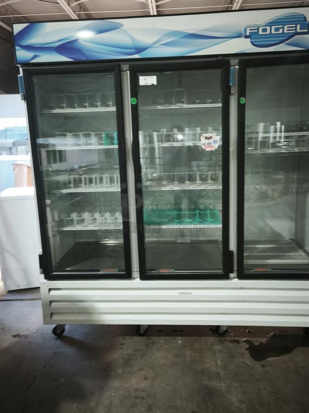 Fogel CR-65-US 78" wide reach-in refrigerator with three hinged glass doors, approx 65 cu ft, good condition.