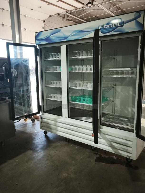 Fogel CR-65-US 78″ wide reach-in refrigerator with three hinged glass doors, approx 65 cu ft capacity, excellent condition.