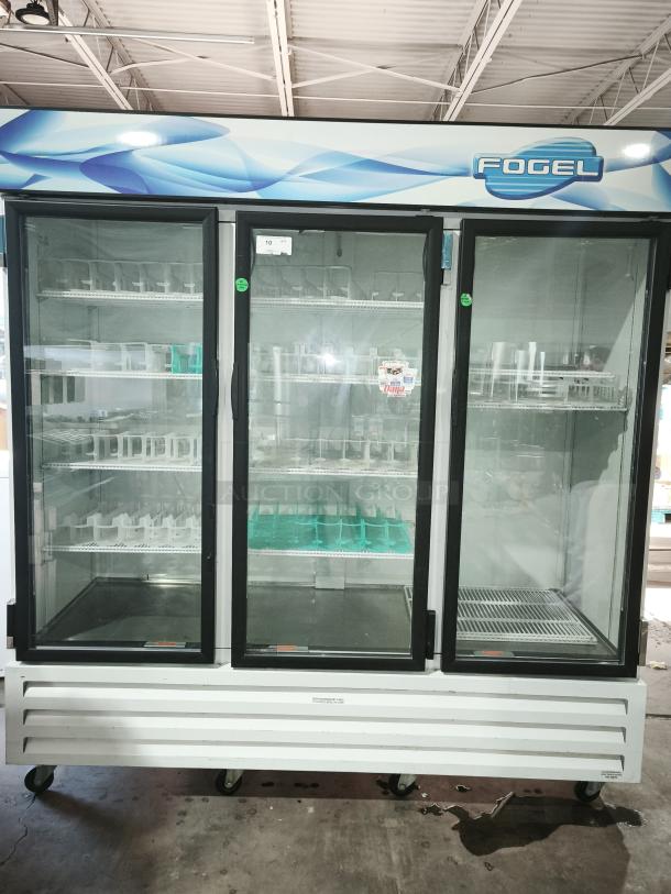Fogel CR-65-US 78" reach-in refrigerator, three glass doors, approx 65 cu ft capacity, on wheels, good condition.