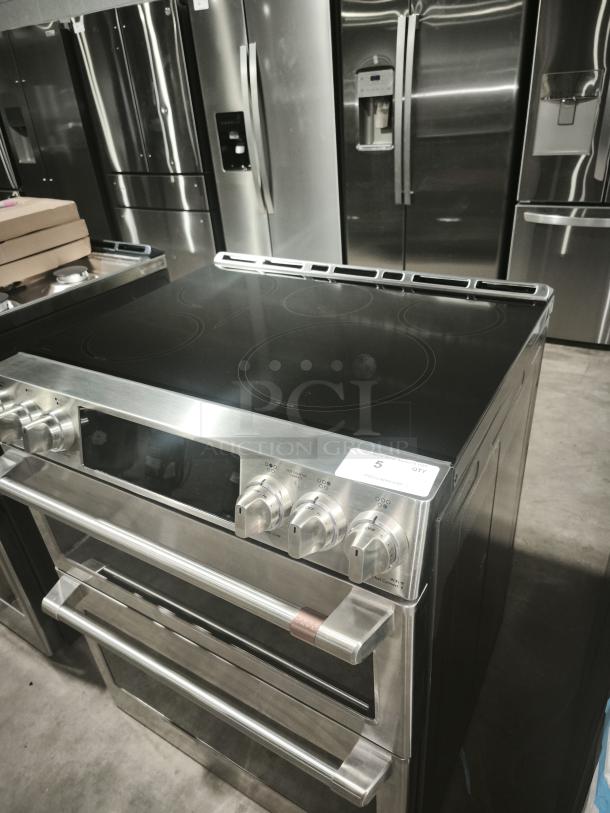 BRAND NEW Café 30″ Smart Slide-In Induction and Convection Double-Oven Range, GE Model CHS950P2MS1, minor scratches.