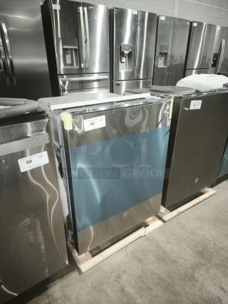 Brand new GE dishwasher, model GDT665SSNSS, with top control, scratches noted. Features Sanitize Cycle and Dry Boost™.
