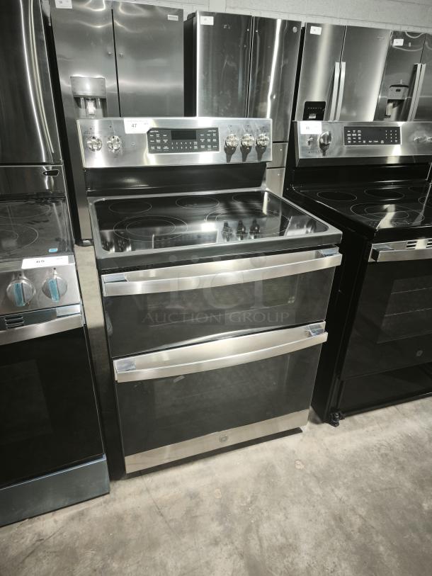 BRAND NEW GE JBS86SPSS electric double oven convection range, stainless steel, free-standing, with slight cosmetic dents.