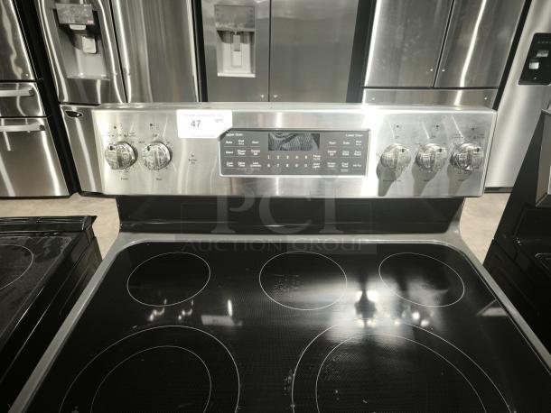 BRAND NEW GE JBS86SPSS electric double oven range, convection, scratch and dent. Stainless finish, control panel visible.