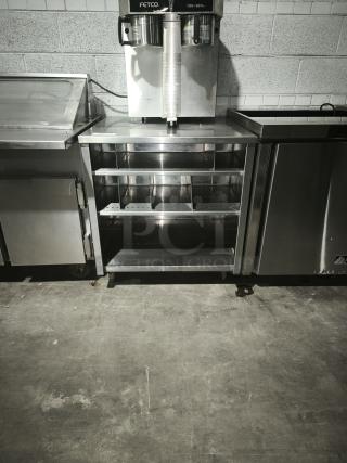 S&G Manufacturing BERS27 stainless steel table with open shelving, in good condition, featuring durable custom design.