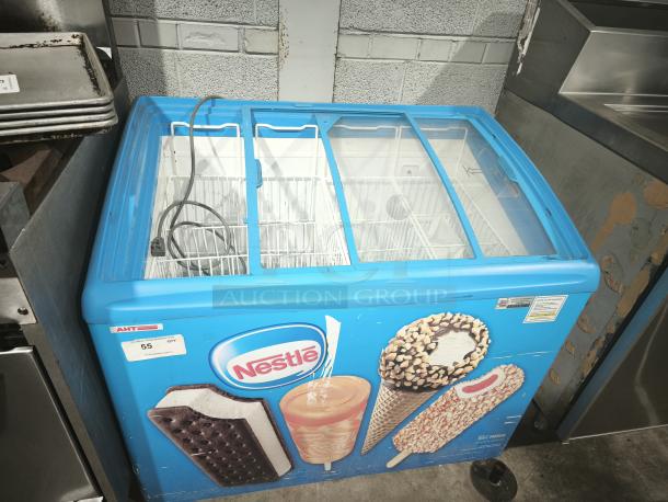 AHT RIO S 100 commercial chest freezer on casters, missing right-side glass pane; 115V, 1 phase, tested and working.