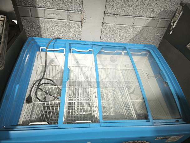 AHT RIO S 100 chest freezer merchandiser, blue, on casters, missing right-side glass pane, 115V, tested, working.