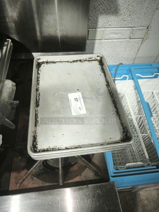 Heavy-duty aluminum half-sheet pan, commercial grade, visibly worn edges, auction tag "57" attached.
