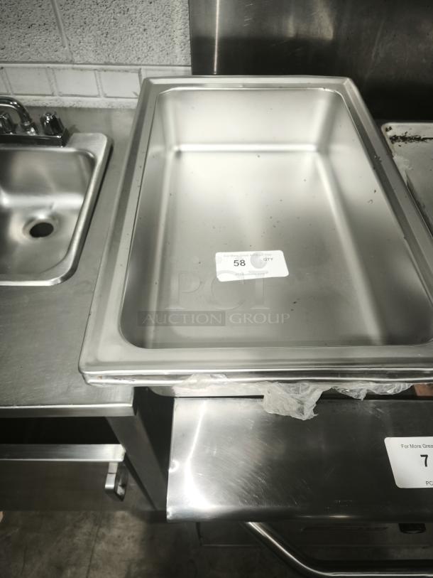 Brand new stainless steel full-size hotel pan, 4" deep. Features durable construction. Label shows item number 58.