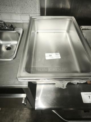 Brand new stainless steel full-size hotel pan, 4" deep. Features durable construction. Label shows item number 58.