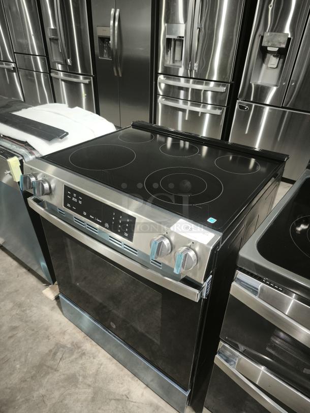 NEW GE 30″ Slide-In Electric Range, Model GRS500PVSS. Features crisp mode, sleek design, and digital controls. New condition.