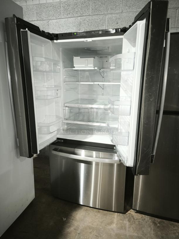 GE 27.7 Cu. Ft. French-Door Refrigerator, model GFE28GYNFS, stainless steel, fingerprint-resistant, open doors.