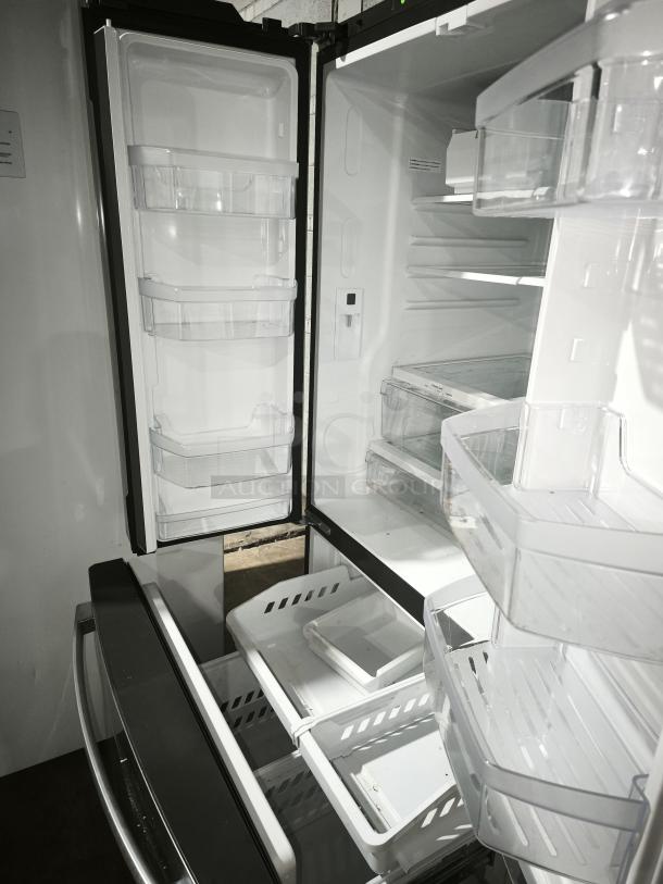 GE 27.7 Cu. Ft. French-Door Refrigerator, stainless steel, model GFE28GYNFS, fingerprint-resistant, spacious interior.